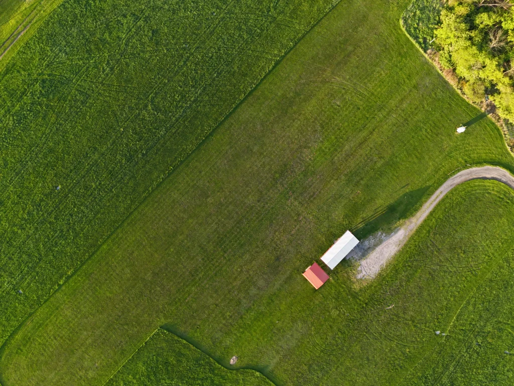 Overhead drone image of a farm field in Ohio, showcasing custom agricultural services like crop health monitoring and aerial data collection.