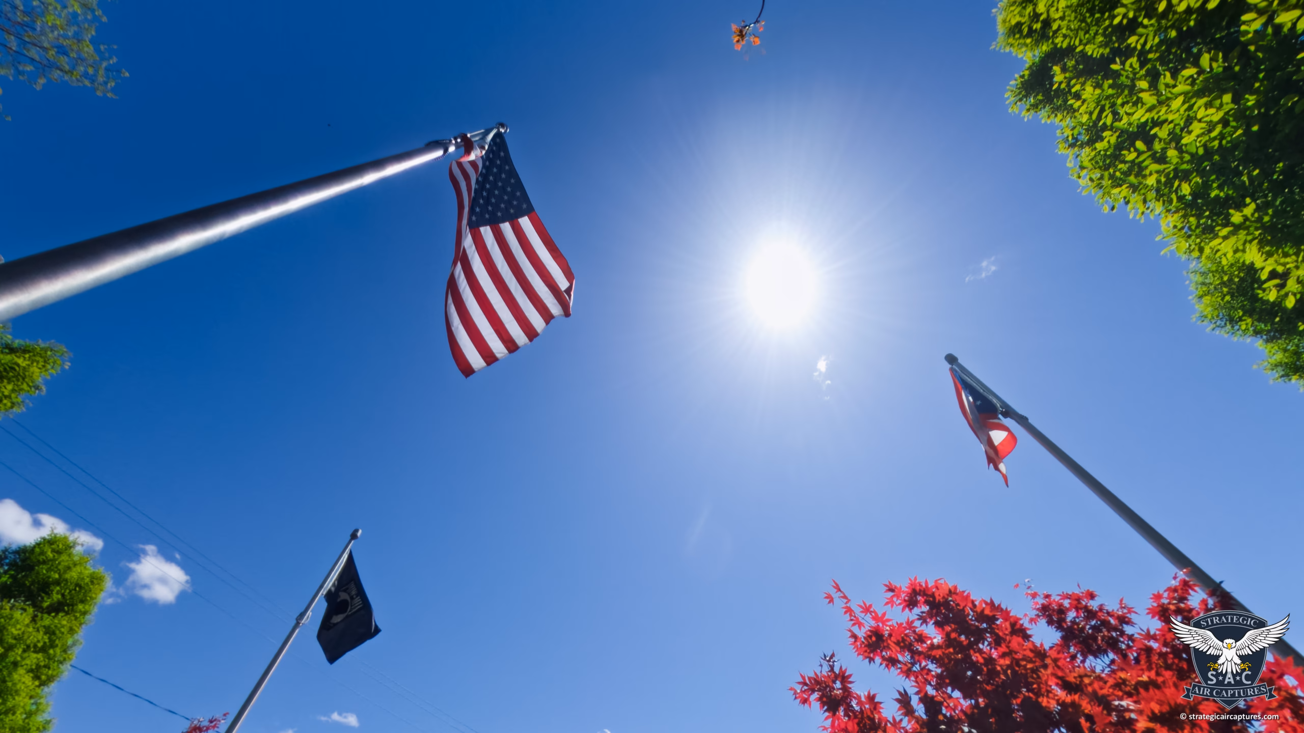 Looking up at the United States flag, surrounded by the State of Ohio flag and the POWMIA flag.