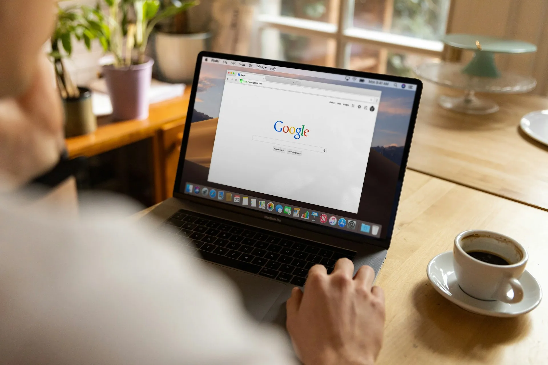 A person browsing Google on their computer on a laptop.